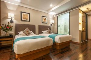 Postel nebo postele na pokoji v ubytování SSAW Boutique Hotel Hefei Intime Centre