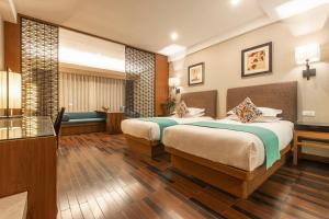 Postel nebo postele na pokoji v ubytování SSAW Boutique Hotel Hefei Intime Centre