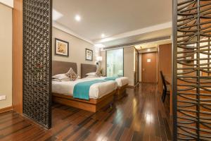 Postel nebo postele na pokoji v ubytování SSAW Boutique Hotel Hefei Intime Centre