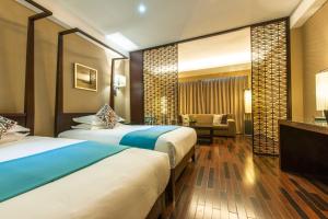 Postel nebo postele na pokoji v ubytování SSAW Boutique Hotel Hefei Intime Centre