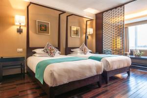 Postel nebo postele na pokoji v ubytování SSAW Boutique Hotel Hefei Intime Centre
