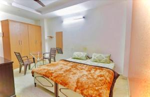 Postel nebo postele na pokoji v ubytování SSS Group Hotel, Dwarka, New Delhi