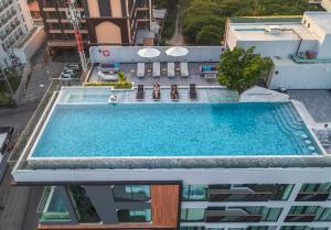an overhead view of a swimming pool on top of a building at Amethyst Hotel Pattaya in Pattaya Central