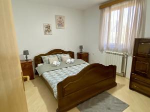 Voodi või voodid majutusasutuse Domus apartman toas