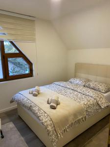 a bedroom with two beds and a window at WoodAvenue in Blidinje