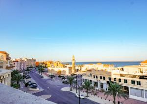 a view of a city street with buildings and the ocean at Karan Sharq for Hotel Apartments Company in Al Jubail