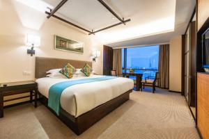 Postel nebo postele na pokoji v ubytování SSAW Boutique Hotel Hefei Intime Centre