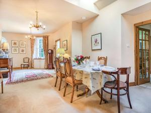 a dining room with a table and chairs at 3 Bed in Edinburgh 87264 in Lasswade