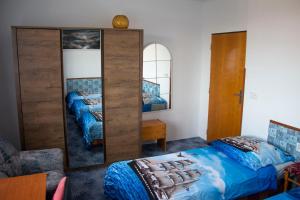 Ein Bett oder Betten in einem Zimmer der Unterkunft Vila Imagina