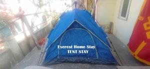a blue tent with the wordsinsert home stay tent stay at Everest Home Stay Apartment in Pātan