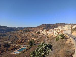 a view of a town on a hill at Ca l'Aleixa Rooms in Bisbal de Falset
