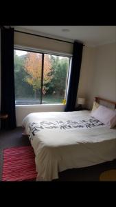 Postel nebo postele na pokoji v ubytování Bali Inspired home