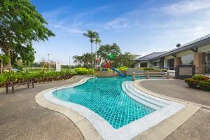 a swimming pool in front of a building at Glenmarie Hotel and Golf Resort in Shah Alam