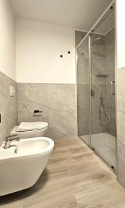 a bathroom with a shower and a sink and a toilet at ANDALO RELAX APARTMENT in Andalo +13 photos