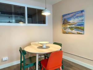a dining room with a table and four chairs at Charming flat in historic centre by Santa Maria in Bermeo