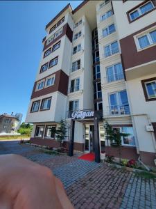 a building on a street in front of a building at kayan apart in Trabzon