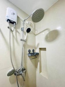 a shower in a bathroom with a sink at * * WV 3 Peaceful Pinnacle in Iloilo City