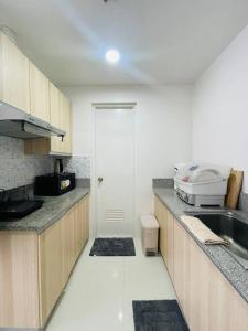 a kitchen with a sink and a counter top at * * WV 3 Peaceful Pinnacle in Iloilo City
