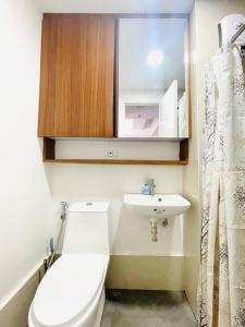 a small bathroom with a toilet and a sink at * * WV 3 Peaceful Pinnacle in Iloilo City