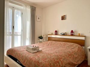Postel nebo postele na pokoji v ubytování Il nido di Curlo