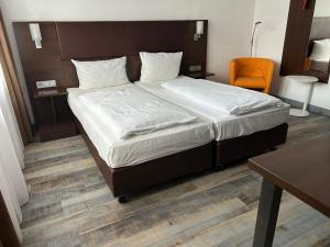 Voodi või voodid majutusasutuse Hotel Fackelmann toas