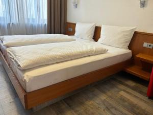 Voodi või voodid majutusasutuse Hotel Fackelmann toas