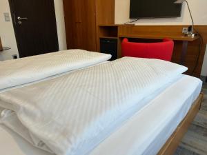 Voodi või voodid majutusasutuse Hotel Fackelmann toas