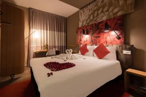 a bedroom with a bed with a heart made out of roses at Ibis Casa Voyageurs in Casablanca