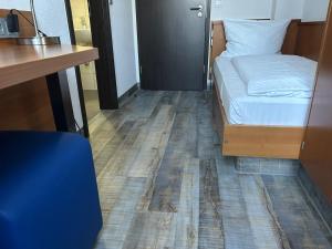 Voodi või voodid majutusasutuse Hotel Fackelmann toas