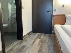 Voodi või voodid majutusasutuse Hotel Fackelmann toas