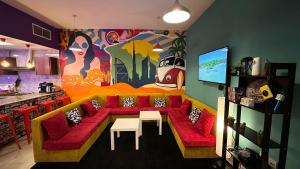 a living room with a couch and a table at Papaya backpacker's in Dubai