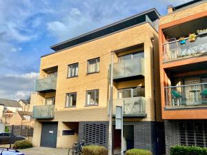 a brick building with balconies on the side of it at Your Space Apartments - Eden House in Cambridge