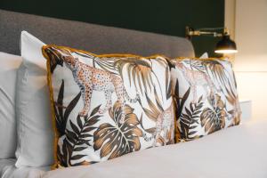 a bed with two pillows with a cheetah on it at Modern & Stylish 1 bedroom flat in Bristol in Bristol