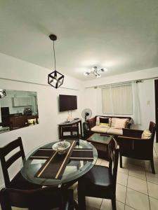 a living room with a table and a couch at Camella Northpoint Bajada Near Sm lanang 2bedroom unit with balcony Davao in Davao City