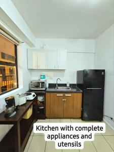 a kitchen withcomplete appliances and utensils at Camella Northpoint Bajada Near Sm lanang 2bedroom unit with balcony Davao in Davao City