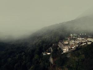 an aerial view of a building on a mountain at Parakkat Nature Resort in Munnar