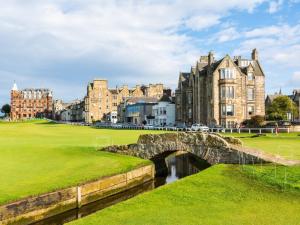 a bridge over a river in front of a castle at 2 Bed in St Andrews 90763 in St Andrews