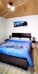 Ένα ή περισσότερα κρεβάτια σε δωμάτιο στο Bilocale Nel Cuore Della Val Di Fiemme