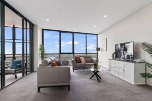 Кът за сядане в Premium 4 Bedroom Family Apartment - Brisbane City
