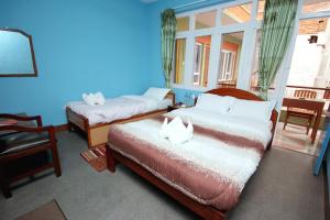 Postel nebo postele na pokoji v ubytování hotel Backpackers inn