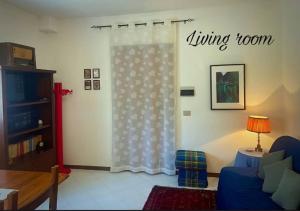 a living room with a living room curtains at La casa di Agilla in Tuoro sul Trasimeno