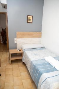 Postel nebo postele na pokoji v ubytování Pension Cuatro Vientos