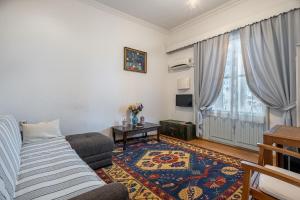 a living room with a couch and a table at Villa Tulipan in Antalya