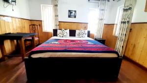 Postel nebo postele na pokoji v ubytování Sapu's Mountain breeze Nuwara Eliya