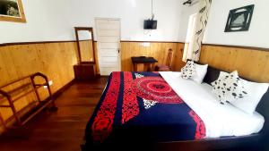 Postel nebo postele na pokoji v ubytování Sapu's Mountain breeze Nuwara Eliya