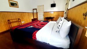 Postel nebo postele na pokoji v ubytování Sapu's Mountain breeze Nuwara Eliya