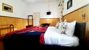 Postel nebo postele na pokoji v ubytování Sapu's Mountain breeze Nuwara Eliya