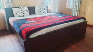 Postel nebo postele na pokoji v ubytování Sapu's Mountain breeze Nuwara Eliya