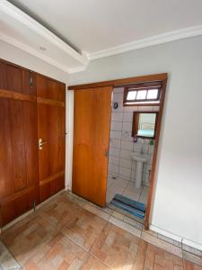 an empty bathroom with a shower and a sink at Quinta Da Estalagem in Pirenópolis +43 photos