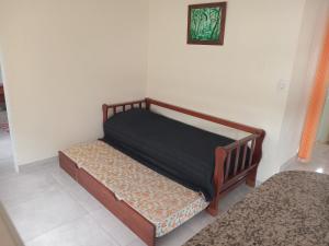 a bed sitting in a corner of a room at Departamento Letty II - Con cochera in San Salvador de Jujuy